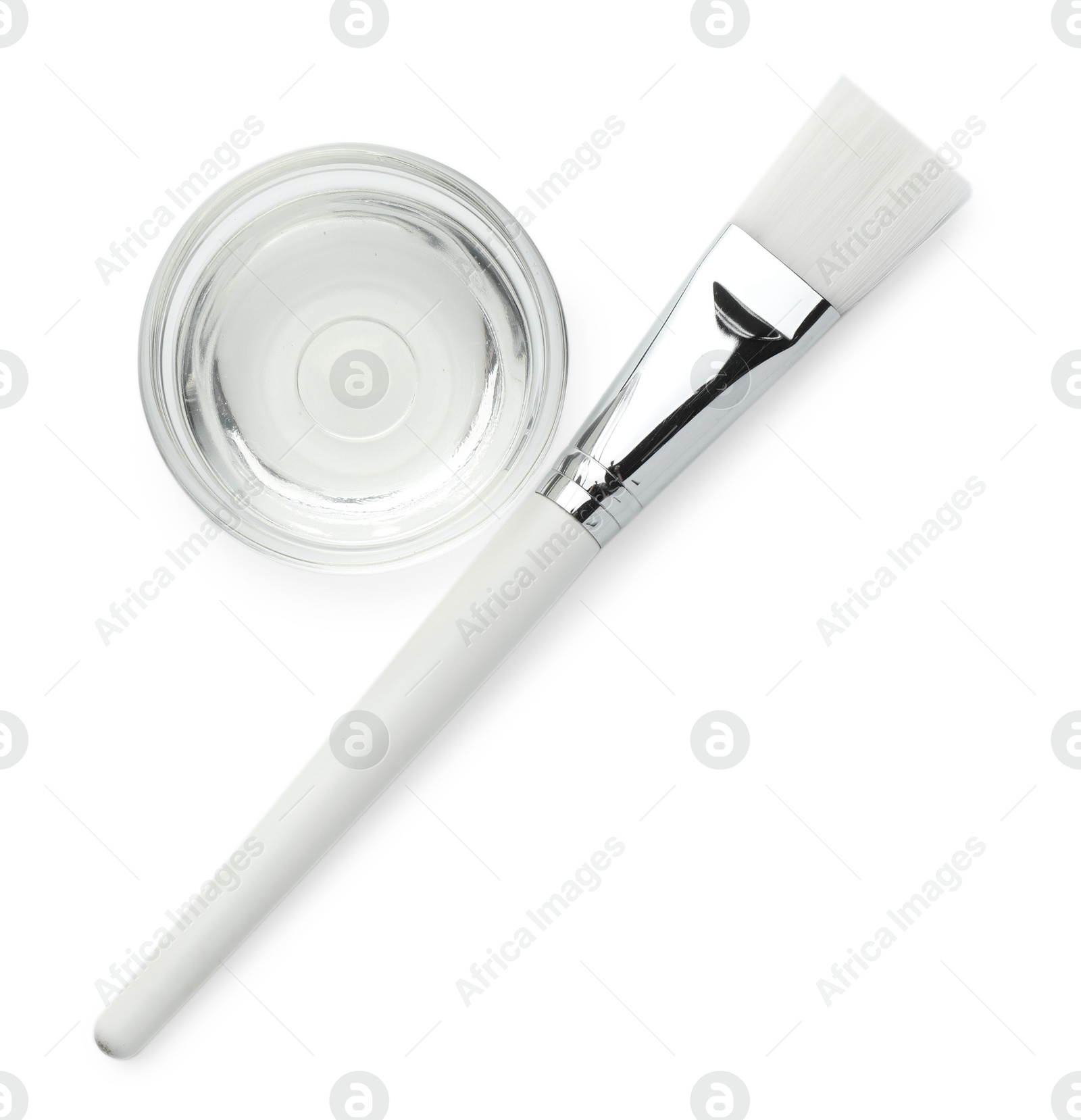 Photo of Bowl of chemical peel and brush isolated on white, top view. Peeling procedure