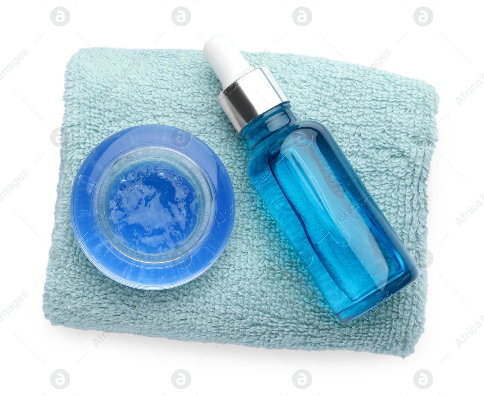 Photo of Bottle of chemical peel, bowl with liquid and soft towel isolated on white, top view. Peeling procedure