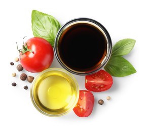 Photo of Delicious balsamic vinegar, olive oil, tomatoes and spices isolated on white, top view