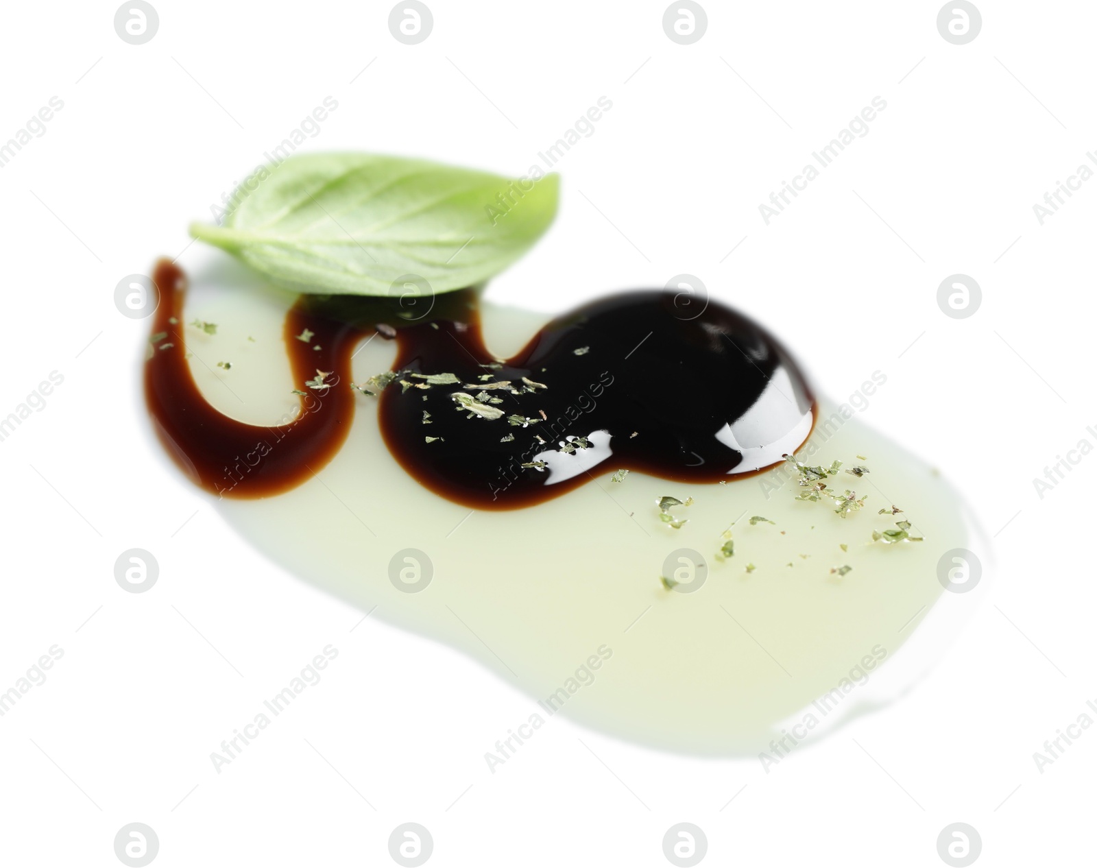 Photo of Delicious balsamic vinegar with olive oil, basil and herbs on white background