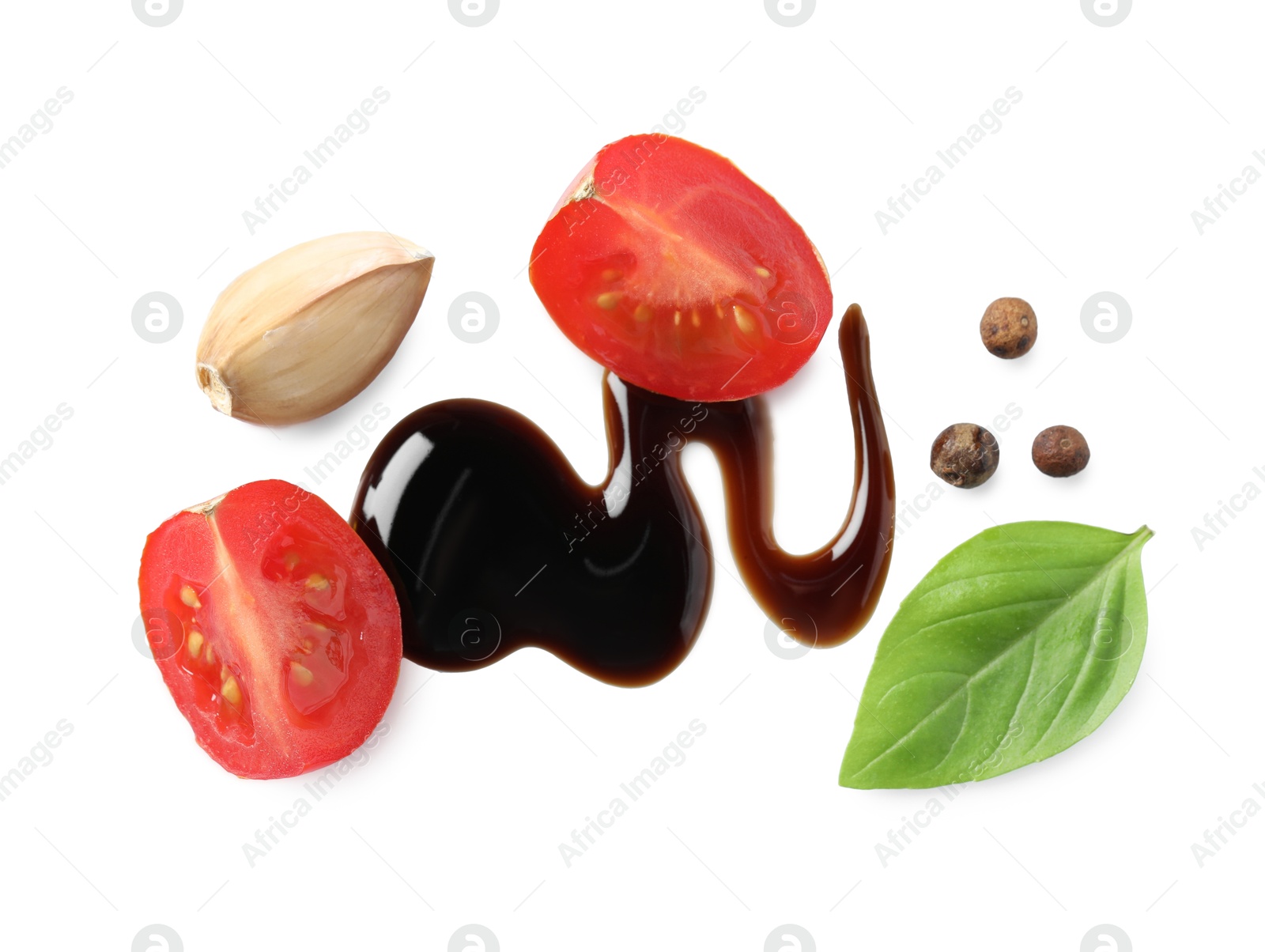 Photo of Delicious balsamic vinegar, tomato, basil, garlic and peppercorns isolated on white, top view