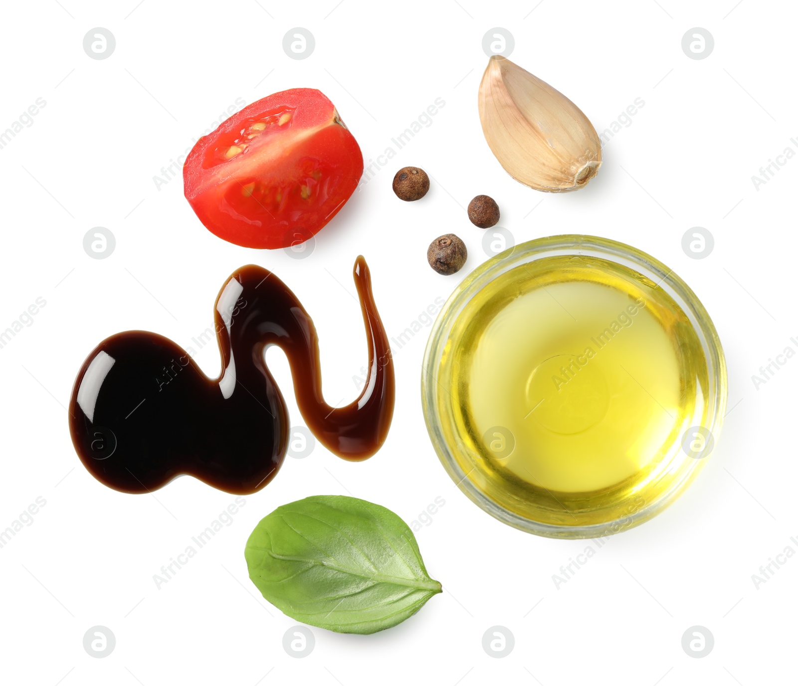 Photo of Delicious balsamic vinegar, olive oil, tomato, basil, garlic and peppercorns isolated on white, top view