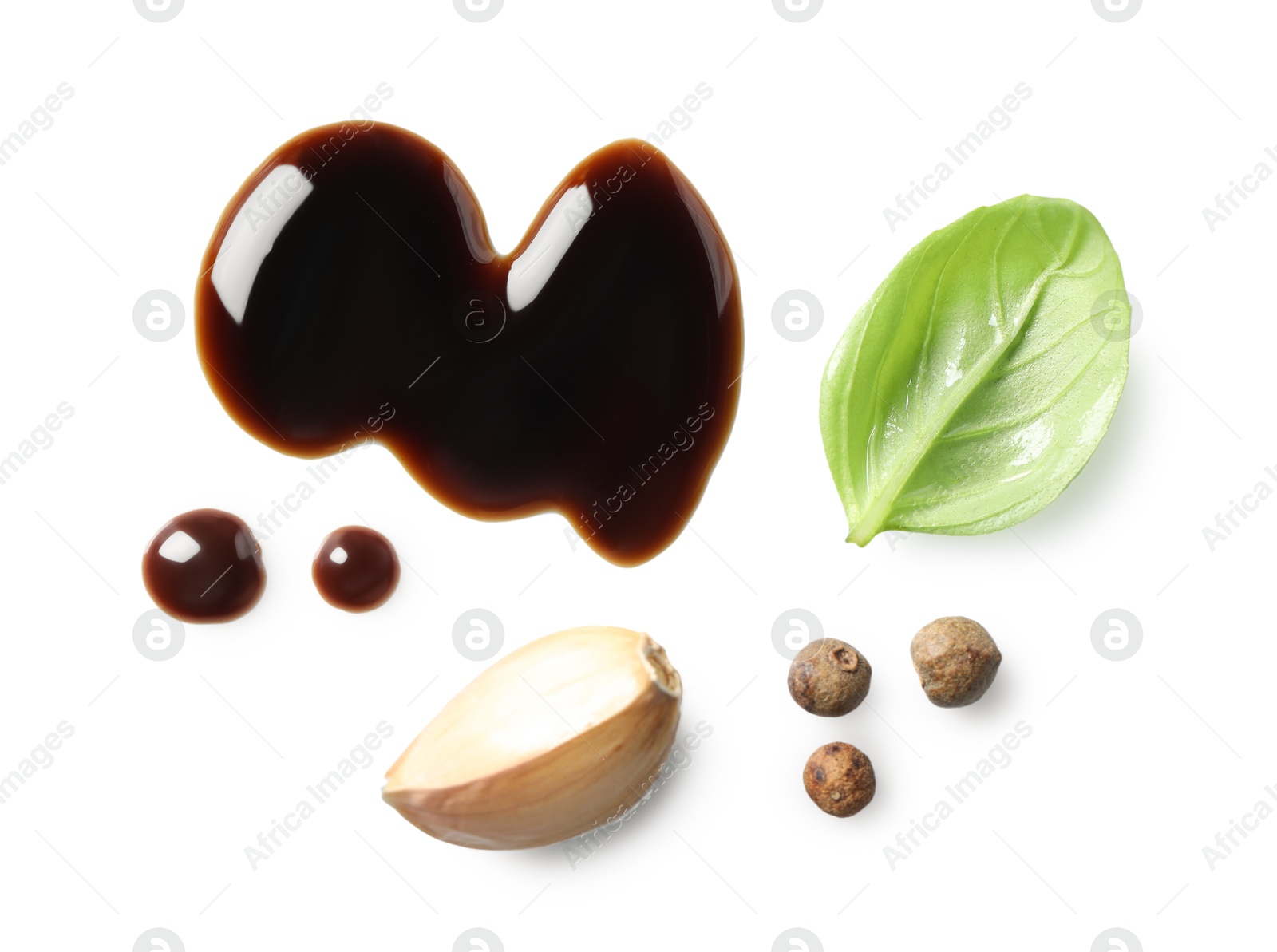 Photo of Delicious balsamic vinegar, basil, garlic and peppercorns isolated on white, top view