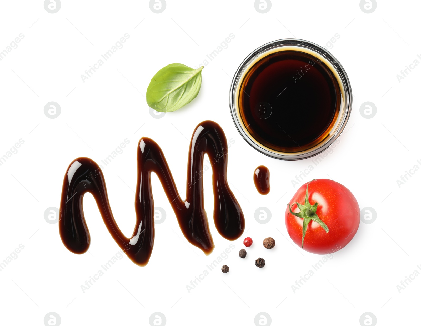 Photo of Delicious balsamic vinegar, tomato, basil and peppercorns isolated on white, top view