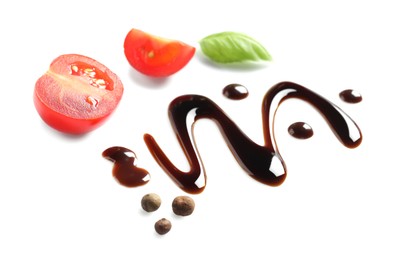 Photo of Delicious balsamic vinegar, cut tomatoes, basil and peppercorns isolated on white