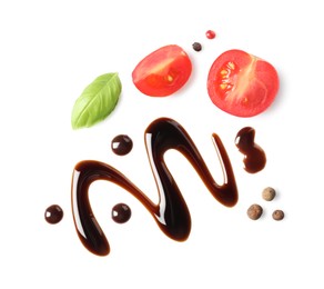 Photo of Delicious balsamic vinegar, cut tomatoes, basil and peppercorns isolated on white, top view