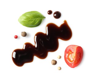 Delicious balsamic vinegar, cut tomato, basil and peppercorns isolated on white, top view