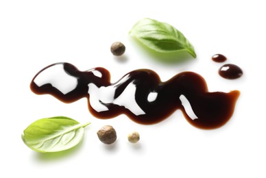 Delicious balsamic vinegar, basil and peppercorns isolated on white