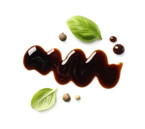 Delicious balsamic vinegar, basil and peppercorns isolated on white, top view