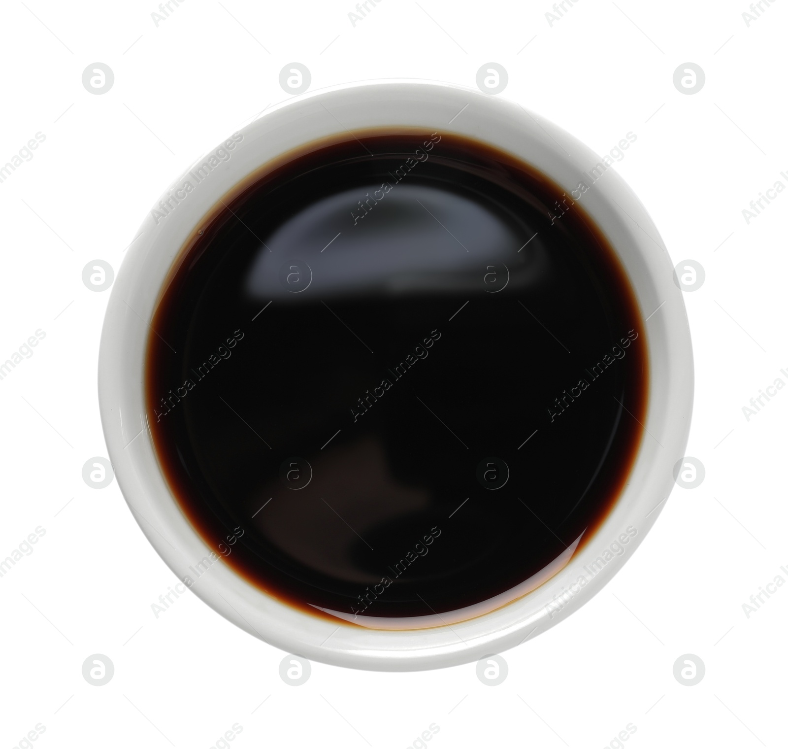 Photo of Balsamic vinegar in bowl isolated on white, top view