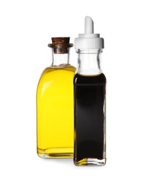 Balsamic vinegar in bottle and oil isolated on white