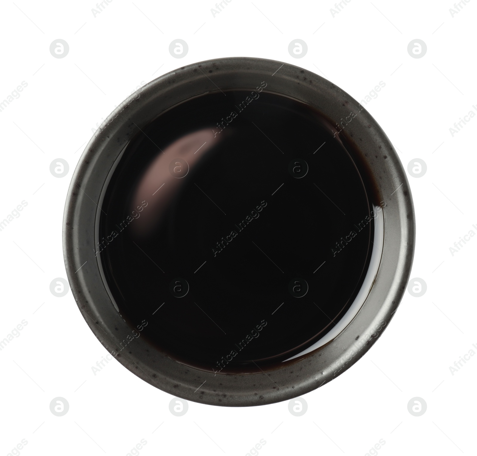 Photo of Balsamic vinegar in bowl isolated on white, top view