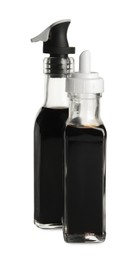 Balsamic vinegar in bottles isolated on white