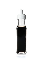 Photo of Balsamic vinegar in bottle isolated on white