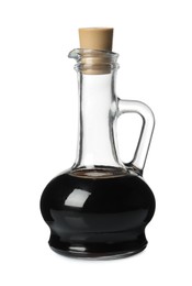 Photo of Balsamic vinegar in glass jug isolated on white