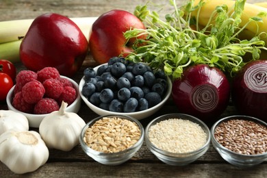 Photo of Different fresh products on wooden table. Source of prebiotics