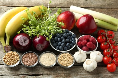 Photo of Different fresh products on wooden table. Source of prebiotics