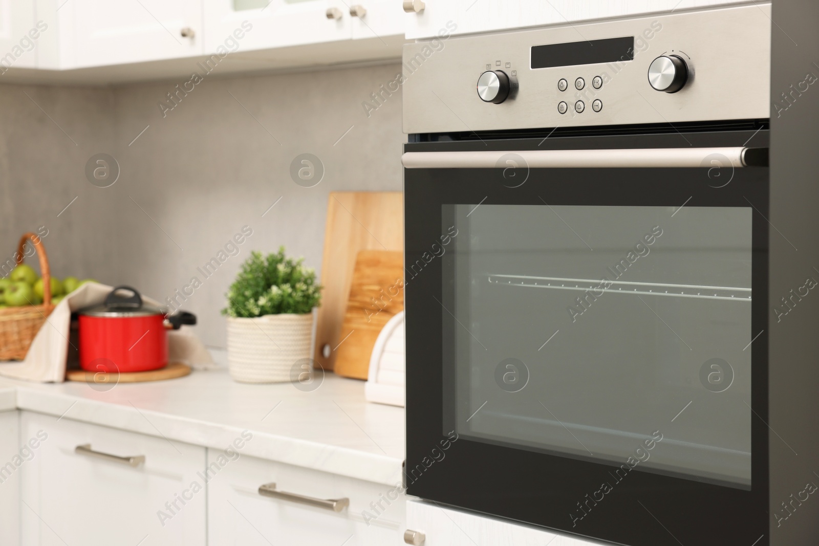 Photo of New electric oven in kitchen. Cooking appliance