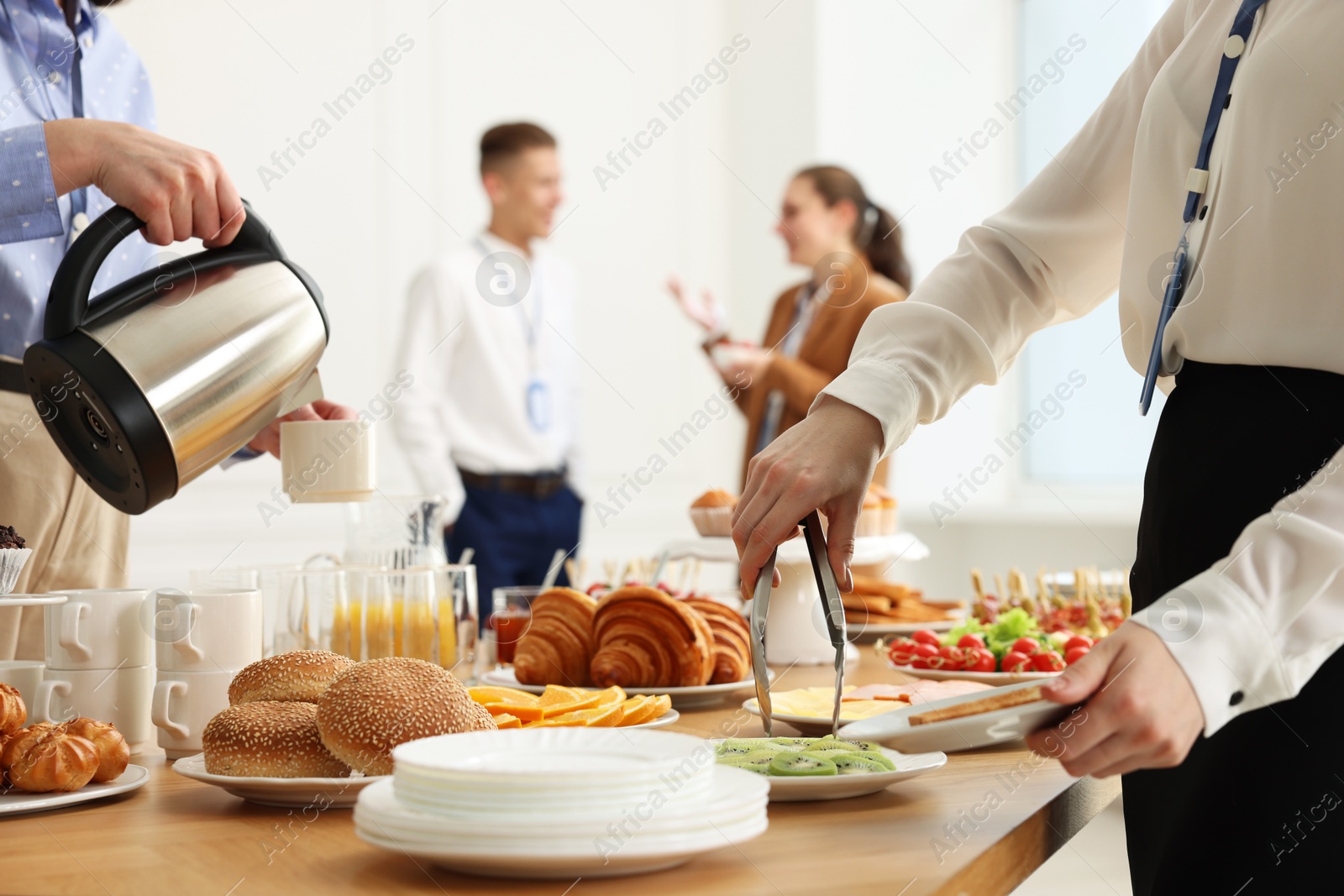 Photo of Coworkers having business lunch in restaurant, closeup