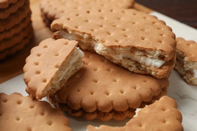 Photo of Fresh tasty sandwich cookies on table, closeup