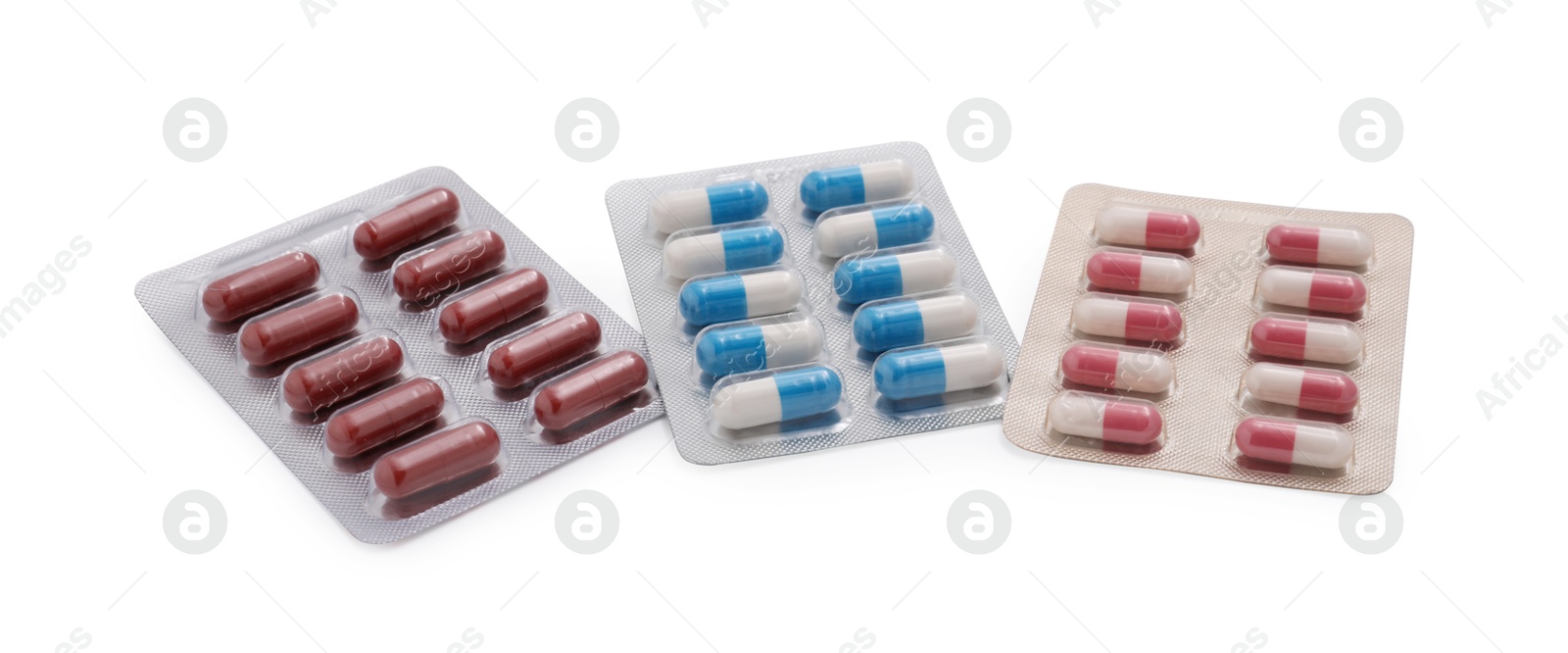 Photo of Different antibiotic pills in blisters isolated on white