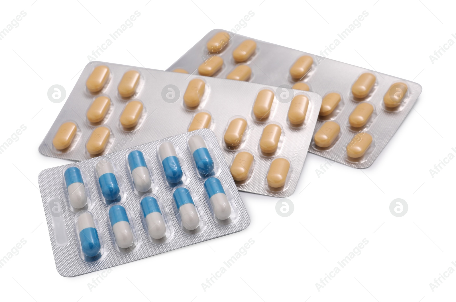 Photo of Different antibiotic pills in blisters isolated on white