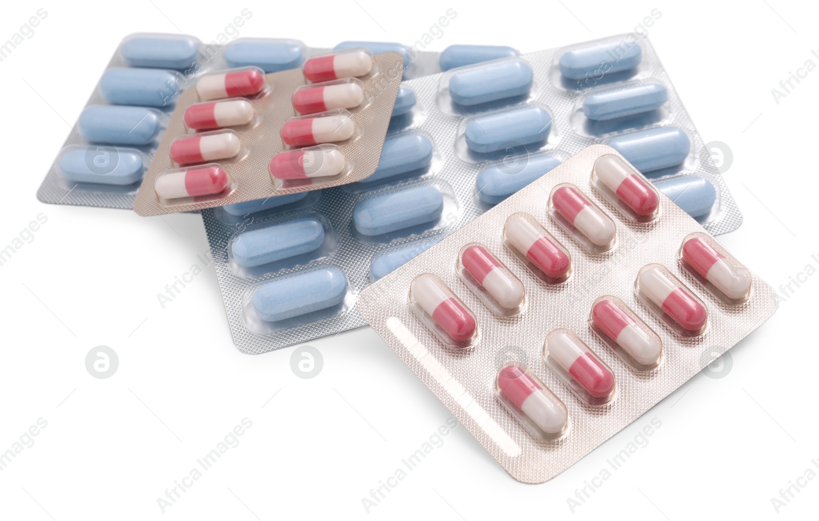 Photo of Different antibiotic pills in blisters isolated on white