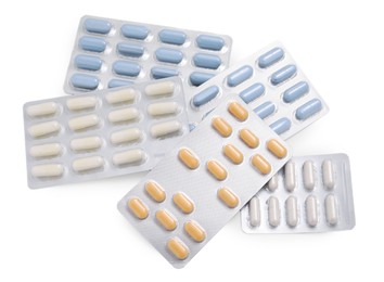 Photo of Different antibiotic pills isolated white, top view