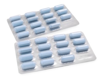 Photo of Antibiotic pills in blisters isolated on white