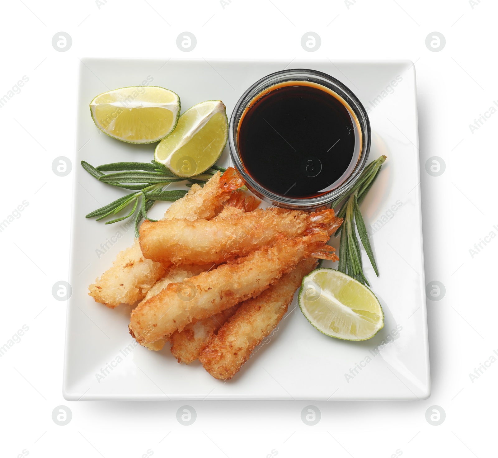 Photo of Delicious breaded fried shrimps with sauce and lime isolated on white, top view