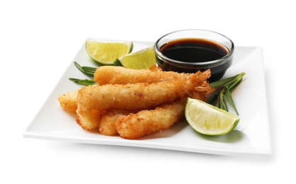 Photo of Delicious breaded fried shrimps with sauce and lime isolated on white