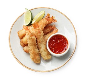 Photo of Delicious breaded fried shrimps with sauce isolated on white, top view