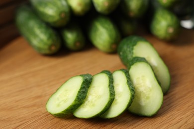 Fresh cut cucumber on wooden board, closeup