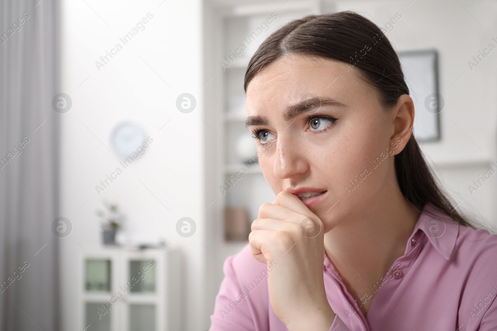 Photo of Portrait of embarrassed woman in office, space for text