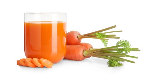 Photo of Healthy carrot juice in glass and fresh vegetables isolated on white