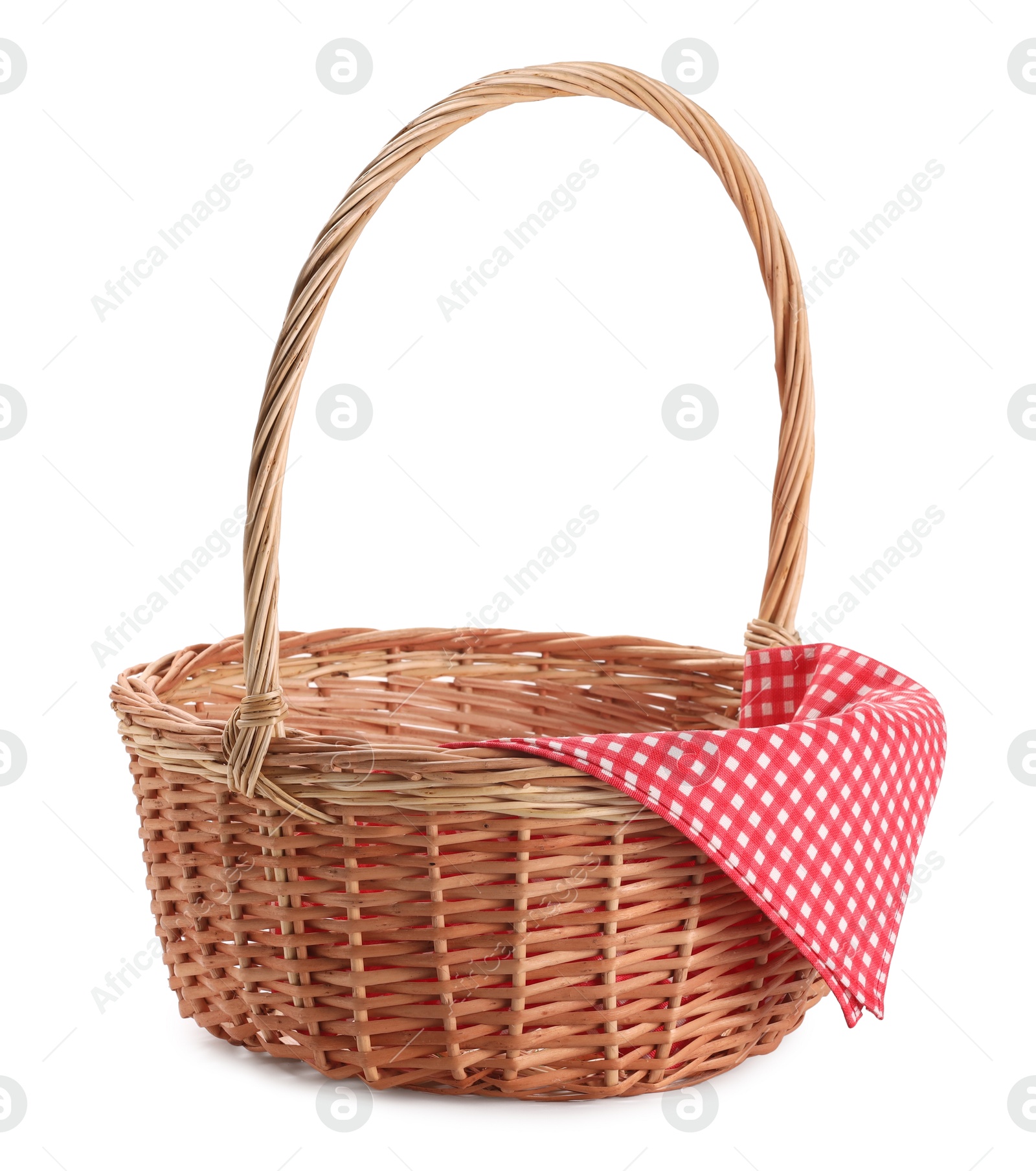 Photo of One picnic wicker basket with checkered napkin isolated on white