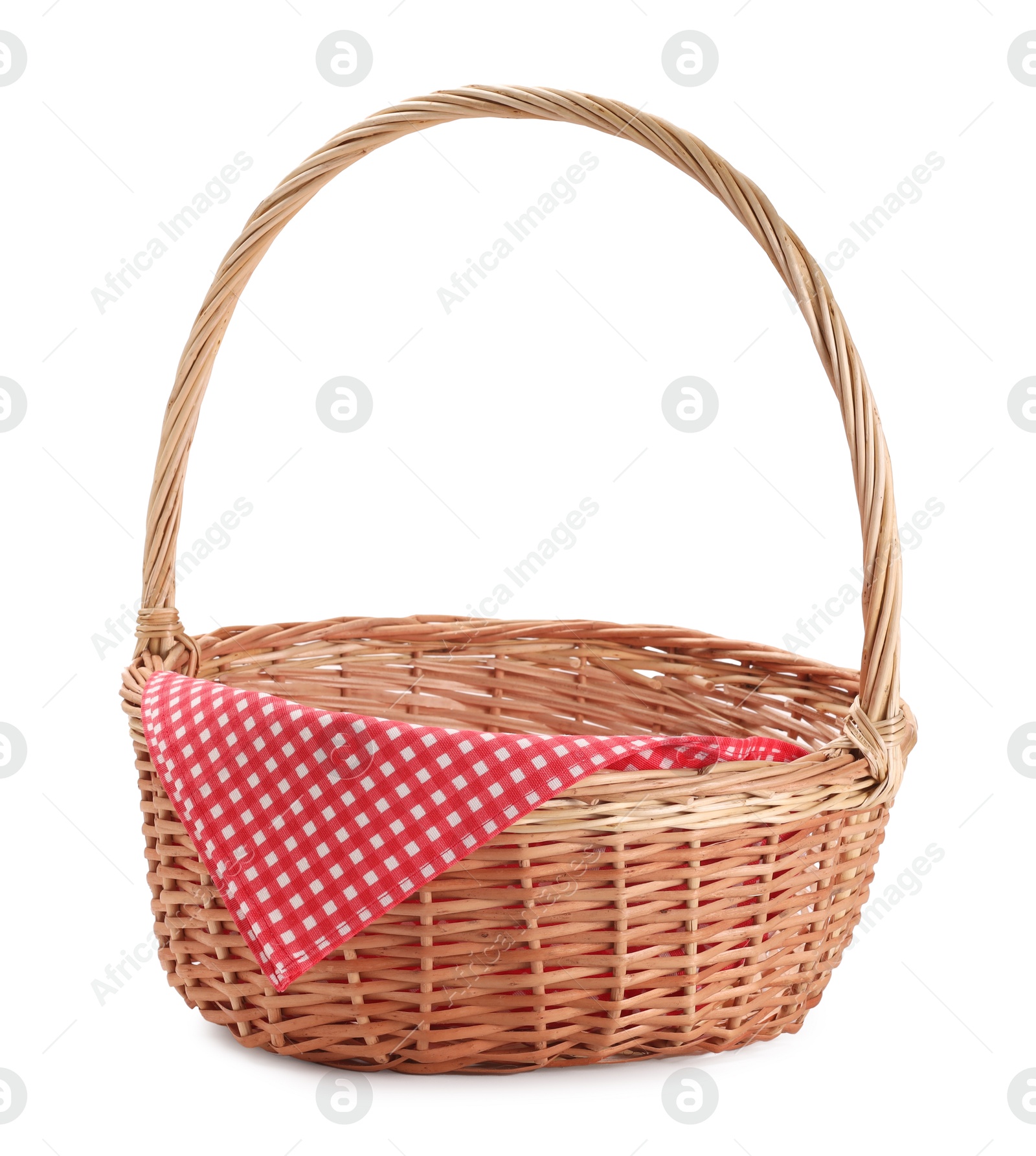 Photo of One picnic wicker basket with checkered napkin isolated on white