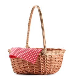 One picnic wicker basket with checkered napkin isolated on white