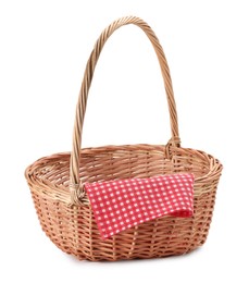 Photo of One picnic wicker basket with checkered napkin isolated on white