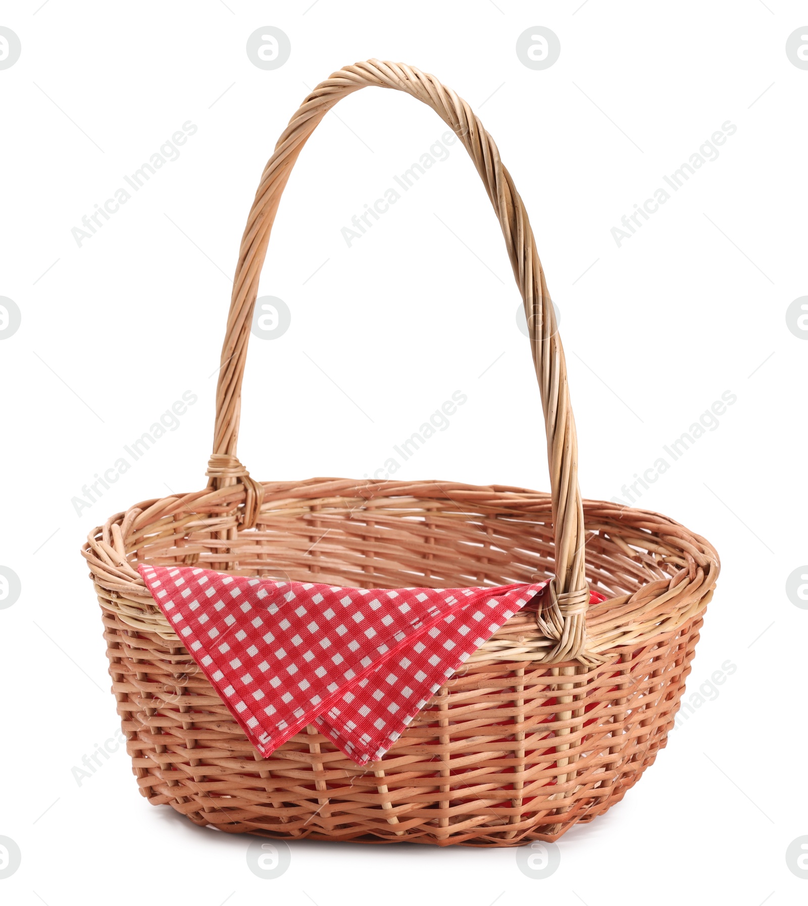 Photo of One picnic wicker basket with checkered napkin isolated on white