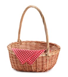 Photo of One picnic wicker basket with checkered napkin isolated on white