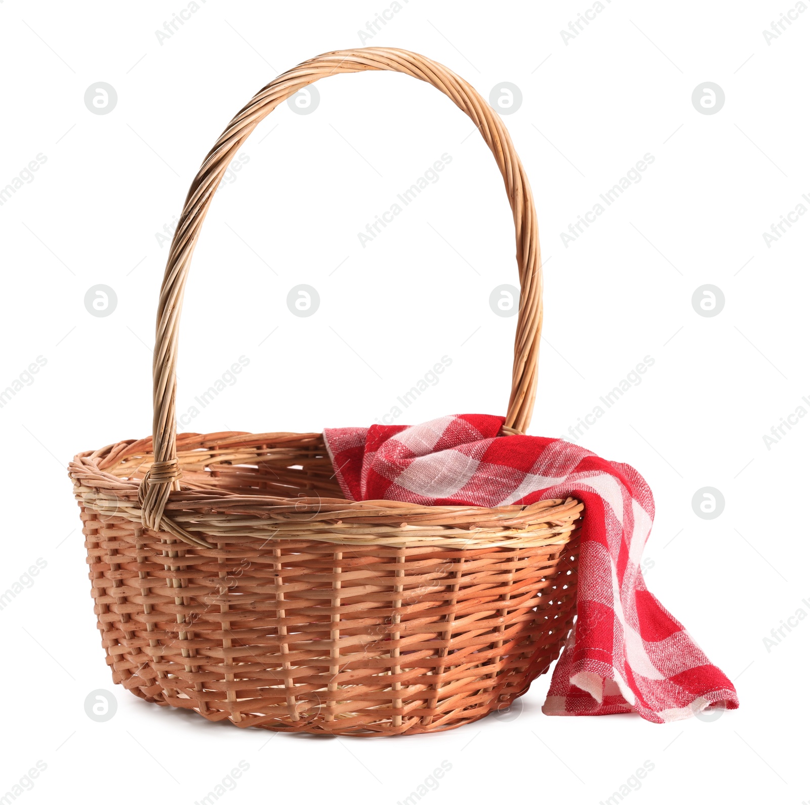 Photo of One picnic wicker basket with checkered napkin isolated on white