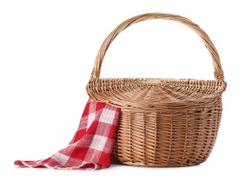 Photo of One picnic wicker basket with checkered napkin isolated on white