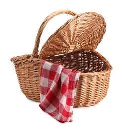 Photo of One open picnic wicker basket with checkered napkin isolated on white