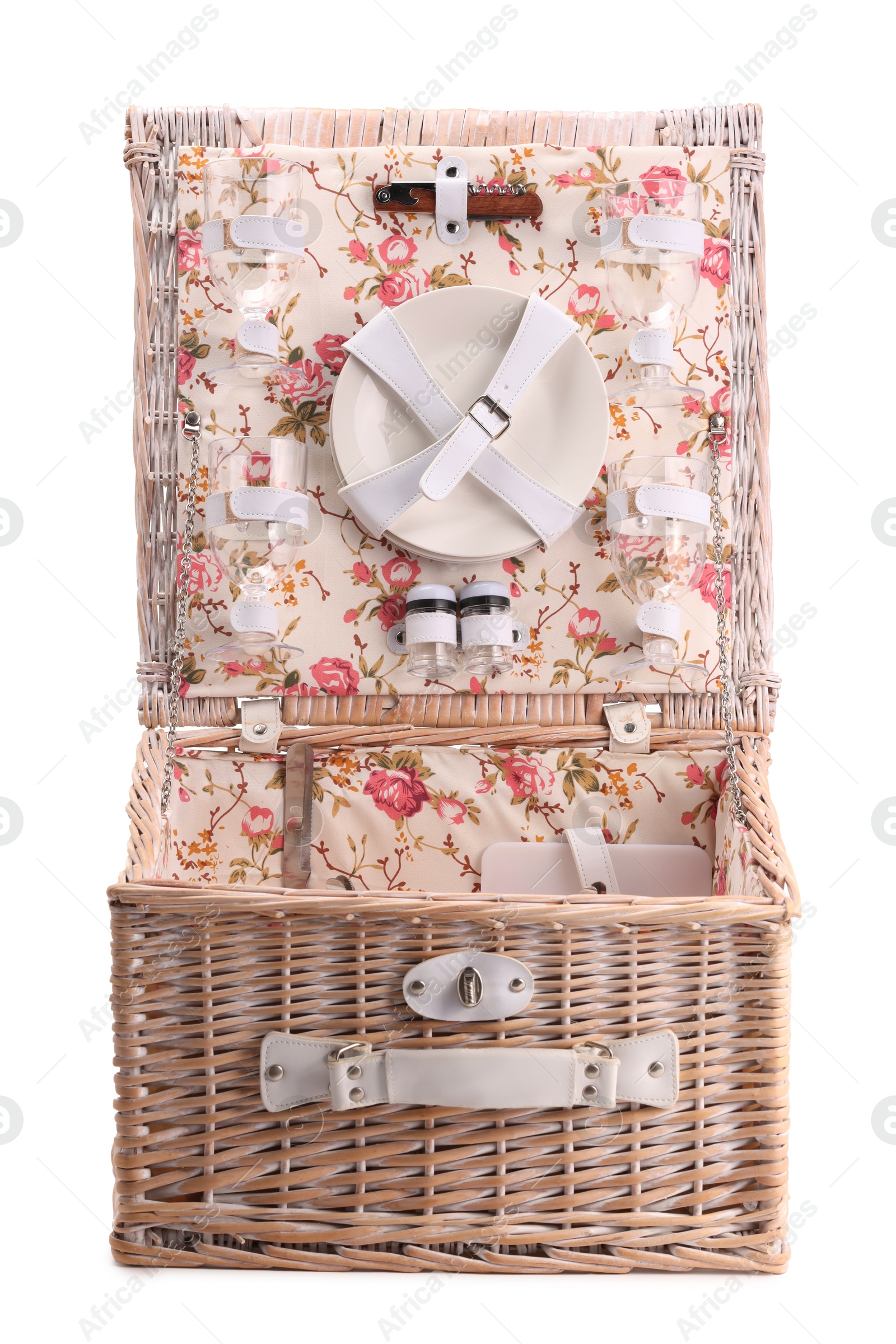 Photo of One open picnic basket with tableware isolated on white