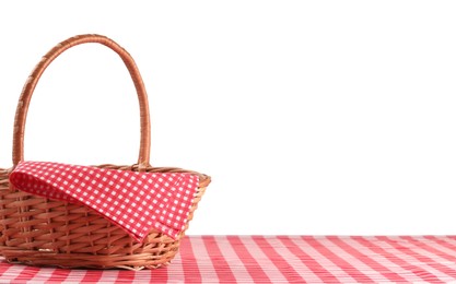 One picnic basket with napkin on table against white background. Space for text