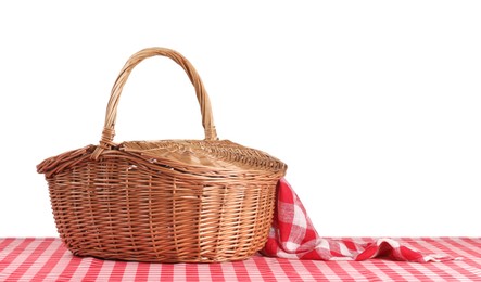 Photo of One picnic basket with napkin on table against white background. Space for text