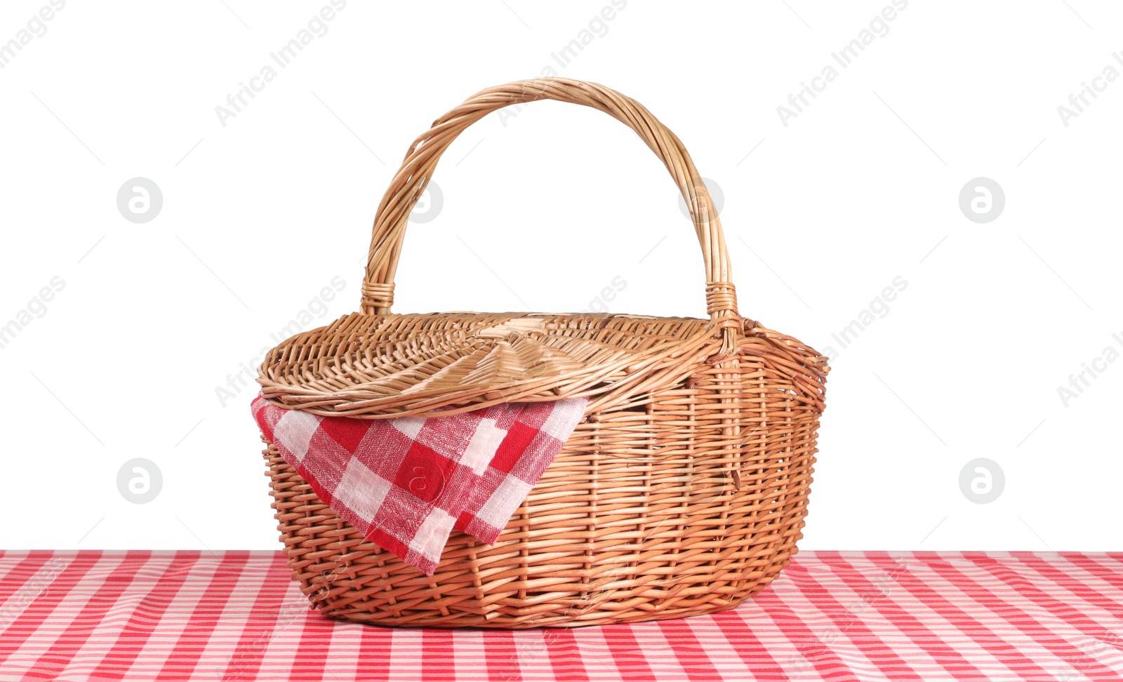 Photo of One picnic basket with napkin on table against white background