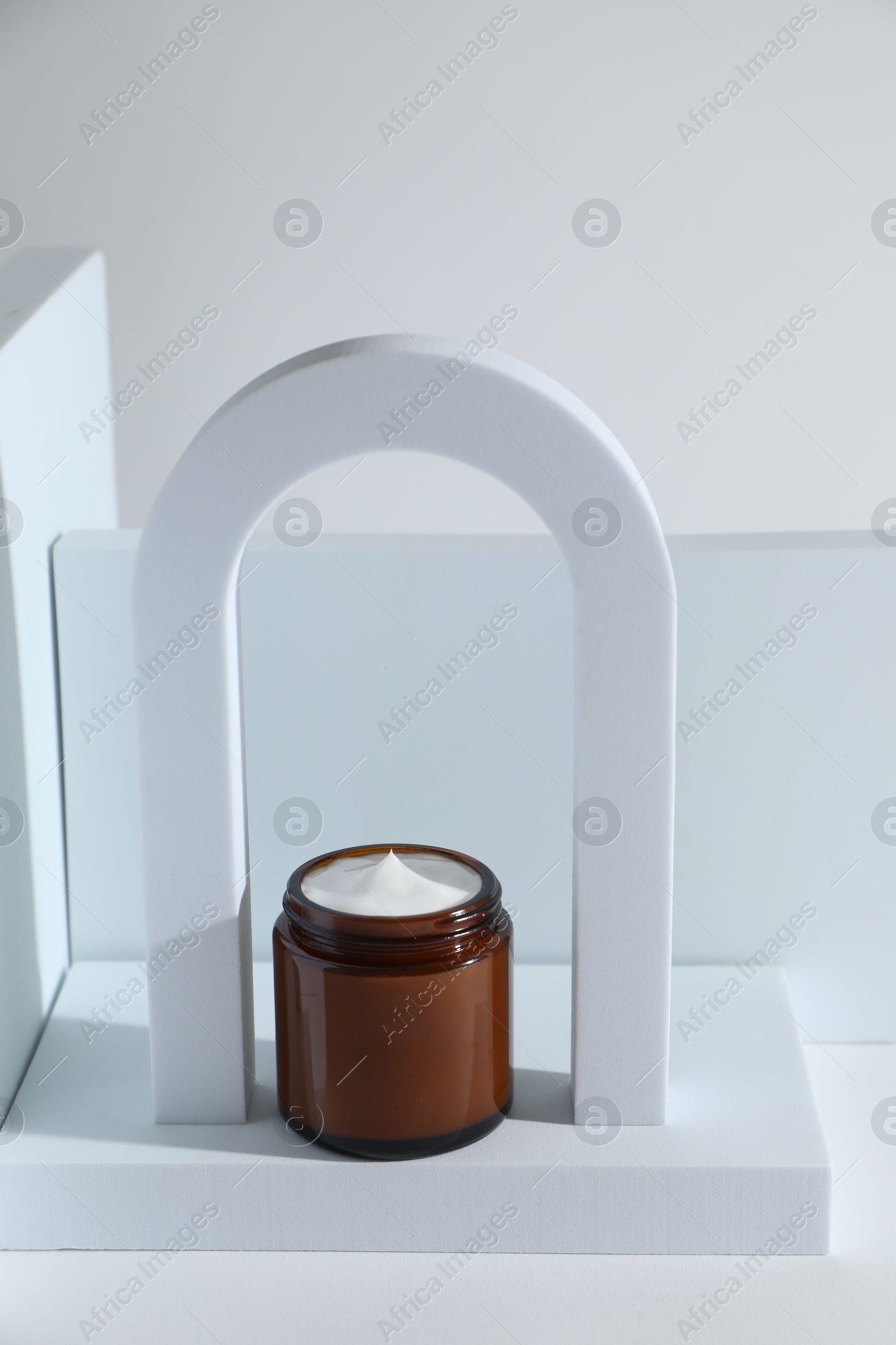 Photo of Stylish presentation of facial cream on white background