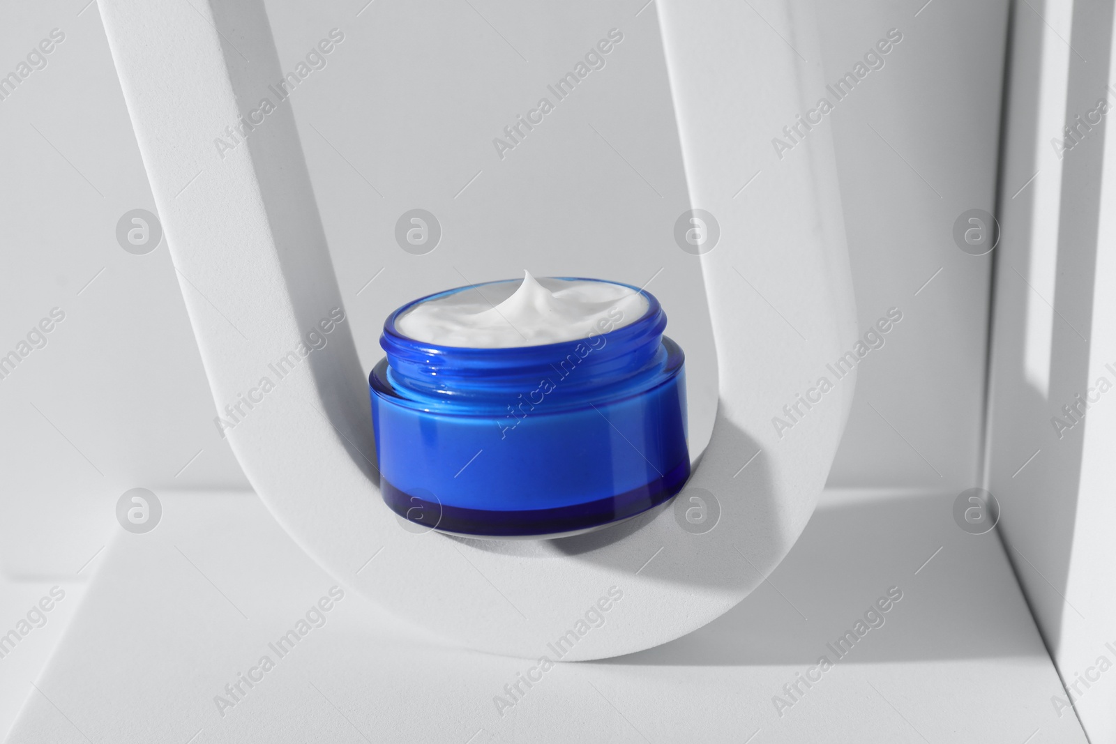 Photo of Stylish presentation of facial cream on white background